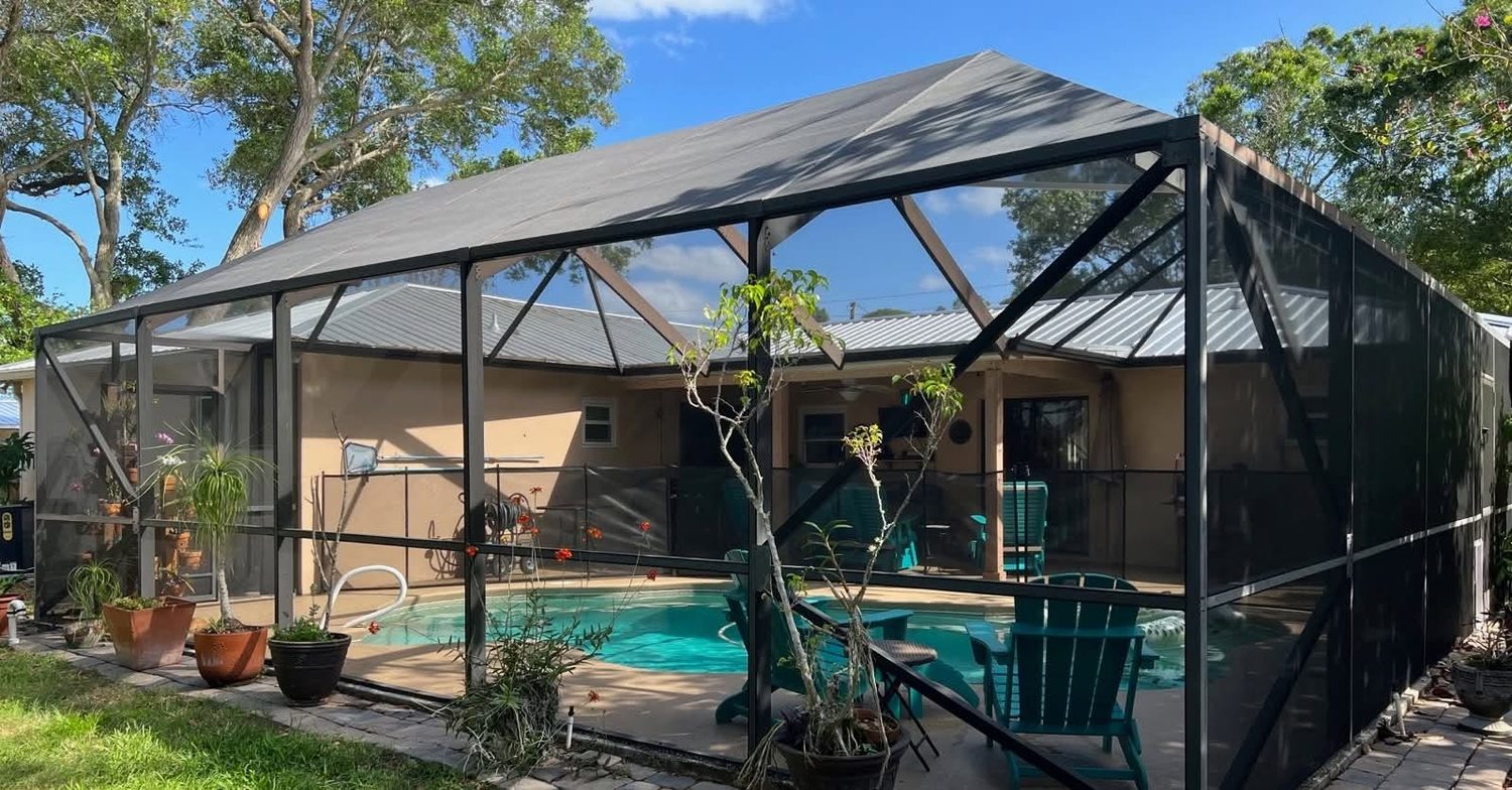 Completed pool screen enclosure with outdoor seating area