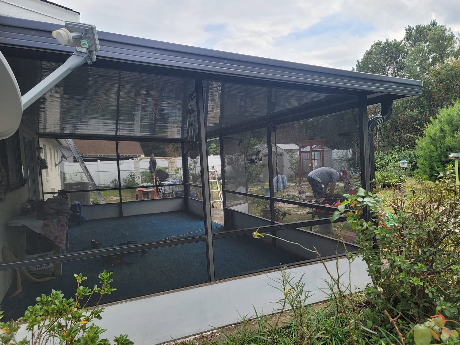 Screened patio with new Super Gutter system installed along roofline